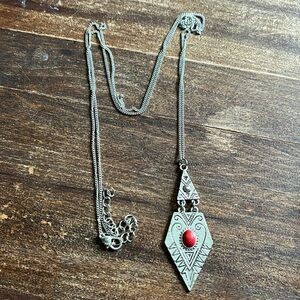 Silver tone long necklace with red stone